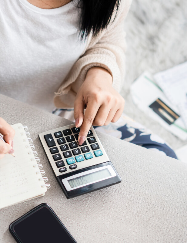 close up on person using calculator